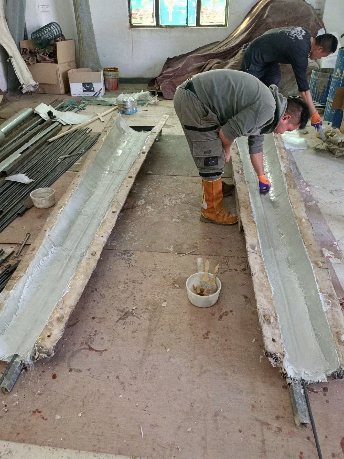 Fiberglass trunk molding with hand-finished bark texture