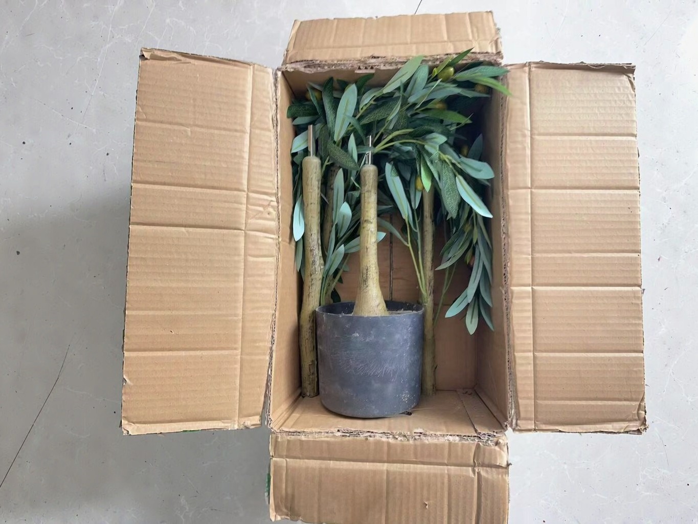 Flat carton packing for knock-down artificial tree, saves shipping volume