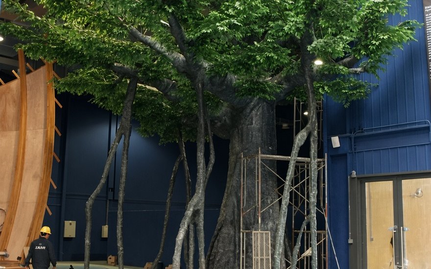 Site installation crew positioning and anchoring a tree (installation on scaffolding)