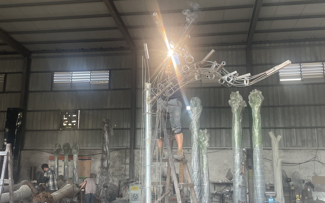 steel branch armature assembled in a workshop bay