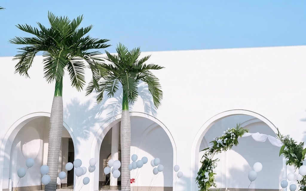 palm trees installed in a resort entrance archway