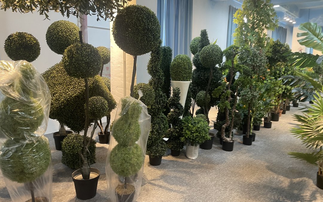 An importer's order calendar for artificial trees: Chinese New Year blackout, GCC peak windows, stock tiers and the cut-off dates that protect a project.