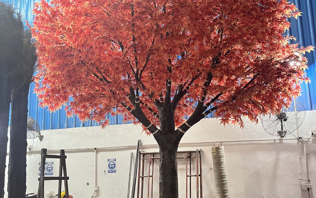 IFR foliage carries its fire rating in the polymer, topical sprays do not. What cleaning does to each, and the evidence authorities ask for at renewal.