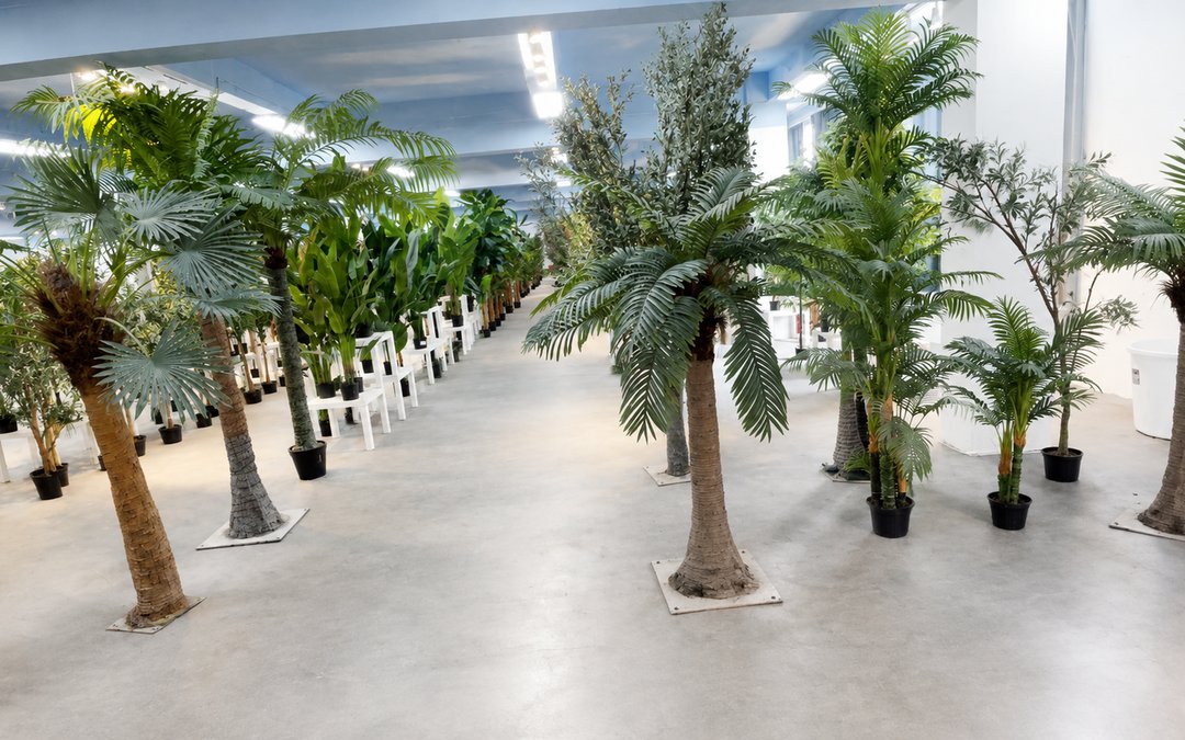 Indoor and outdoor palm builds staged in the factory showroom before export