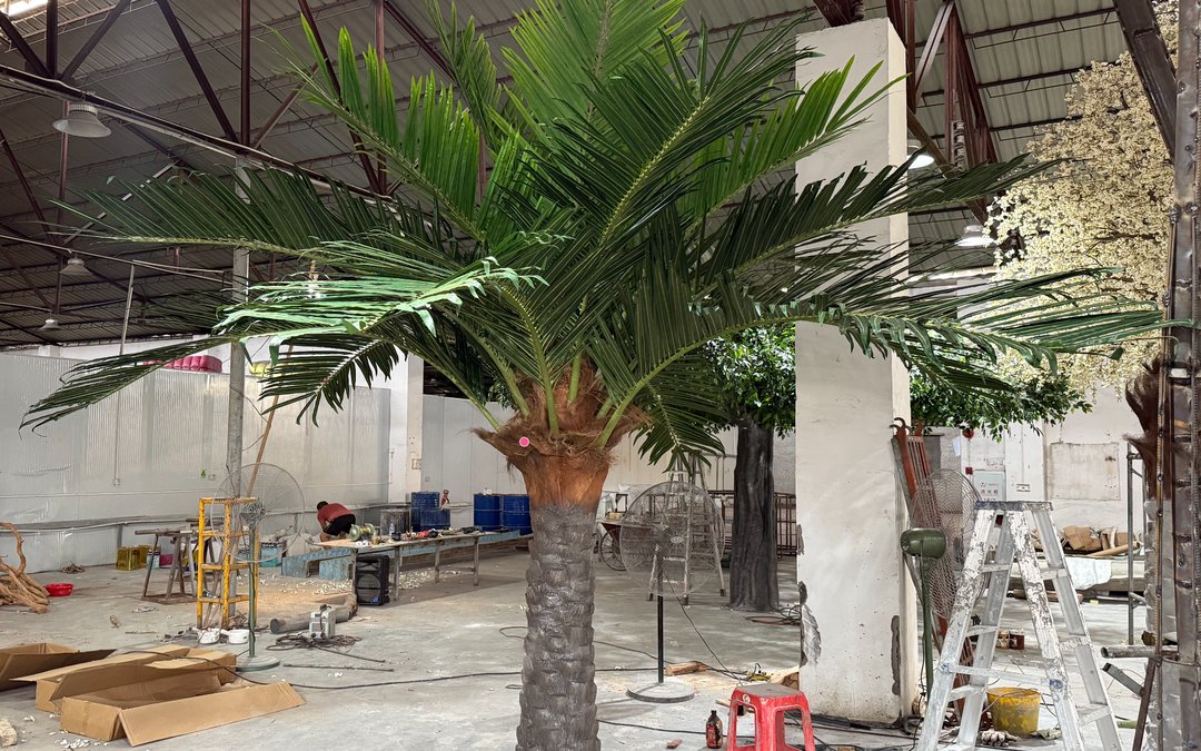 Finished artificial palm standing in the assembly hall during final check