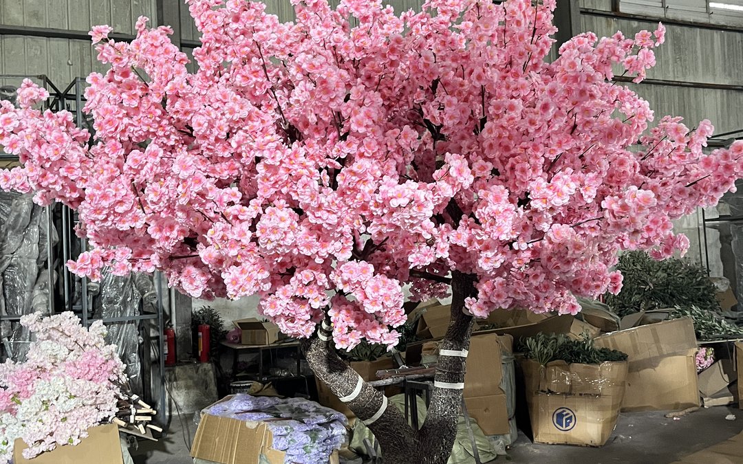 A finished blossom tree in the packing bay with cartons and wrapping staged around it