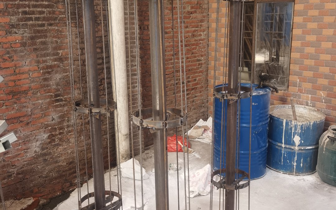 welded steel armature frames with ring collars in the workshop yard