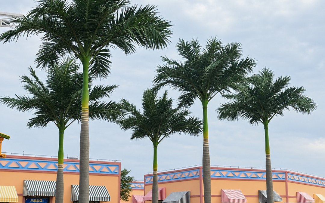 Row of artificial palms along a retail frontage with base connections below the finish line
