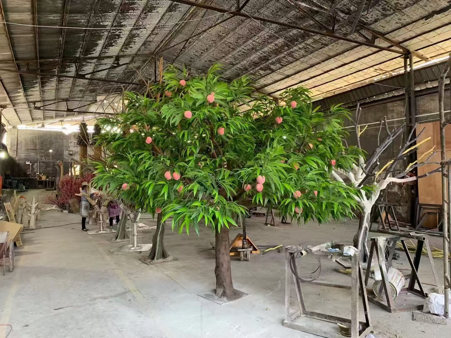 Peach tree with hand-set fruit in our factory workshop