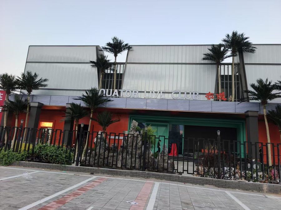 Artificial palm trees flanking a restaurant frontage in Miami, USA