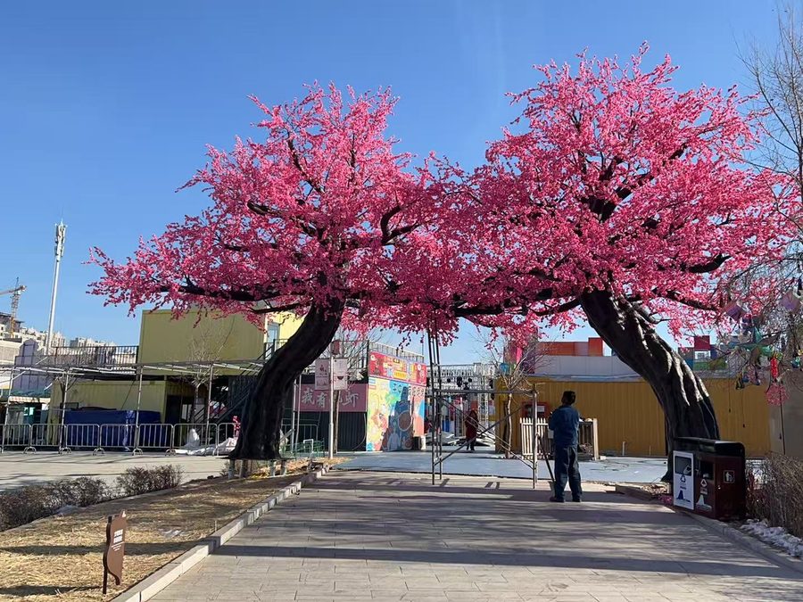 Artificial cherry blossom trees along a retail street in Tokyo, Japan