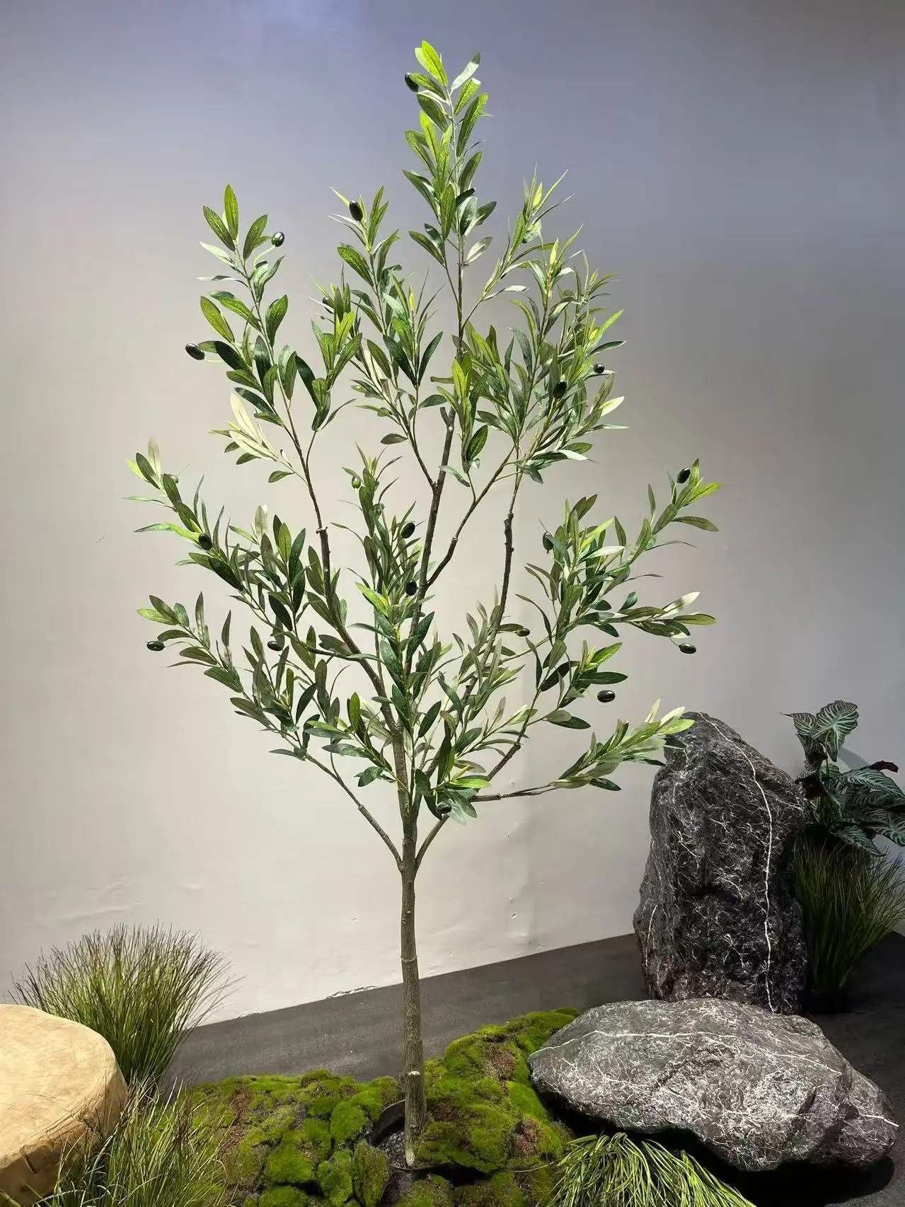 Bonsai-form artificial olive tree with a thick gnarled trunk