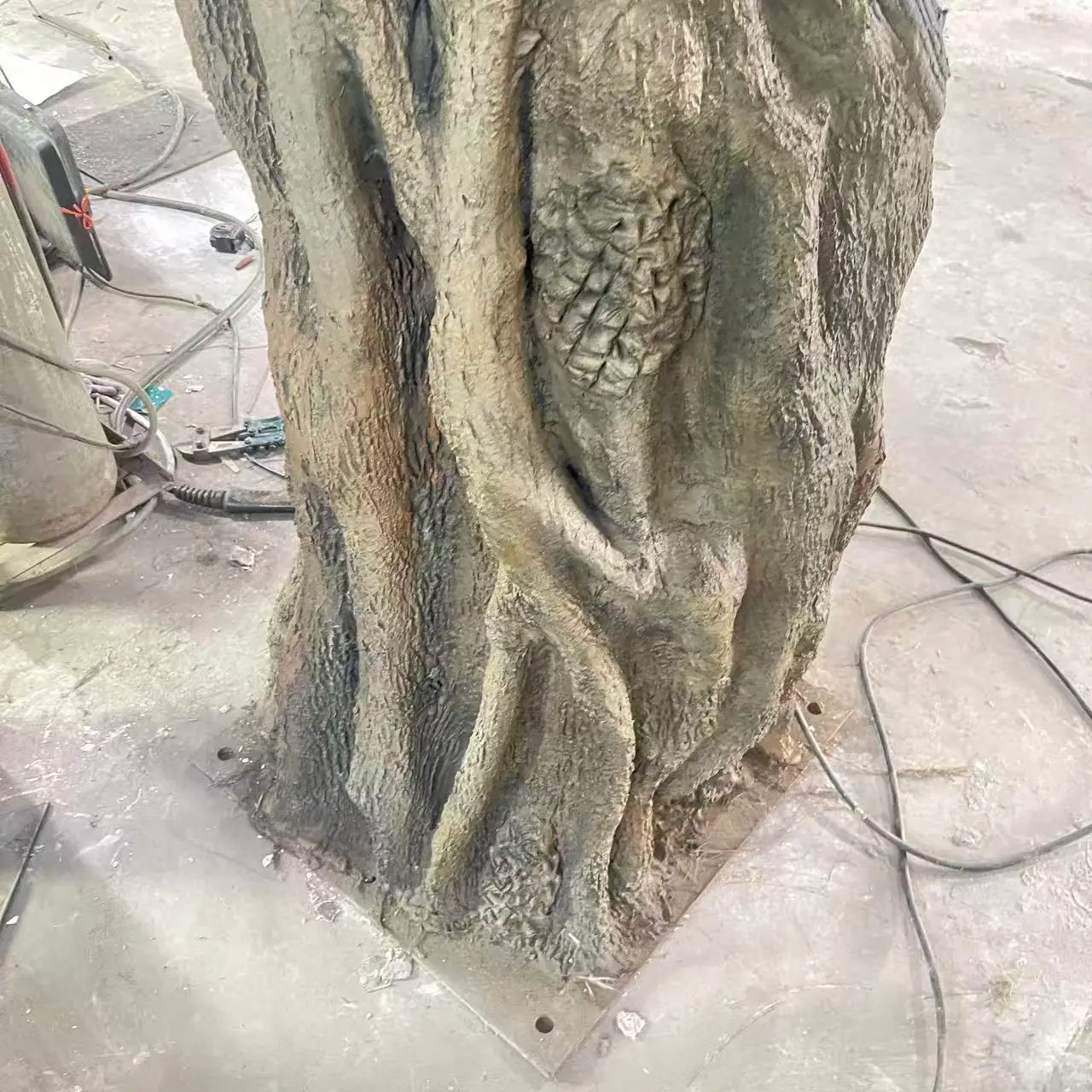 Trunk base detail checked for carving and finish consistency